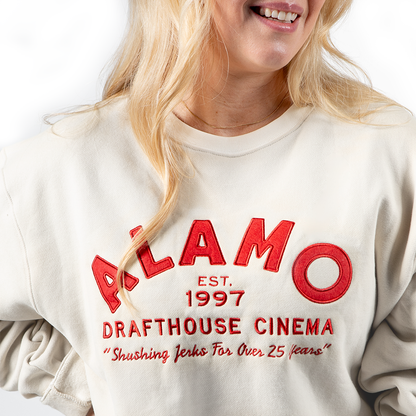woman wearing Alamo Drafthouse Shushing Since '97 Crew-Neck Sweatshirt