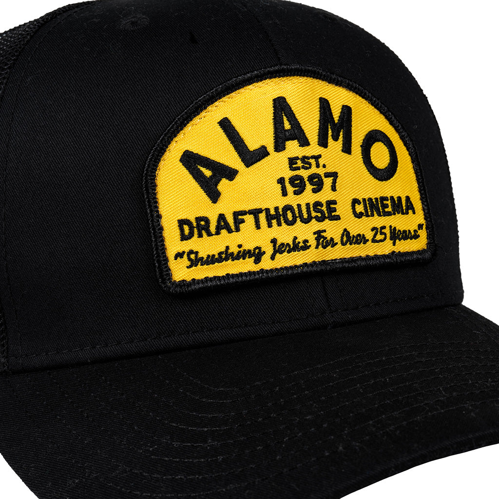 close-up of patch on Professional Shusher Trucker Hat