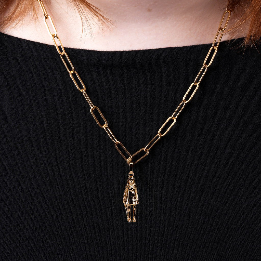 close-up of woman wearing M3GAN 2.0 Charm attached to the Paperclip Charm Chain