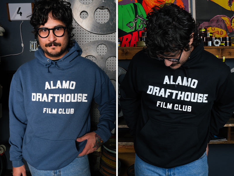 man wearing denim blue and black versions of the Alamo Drafthouse Film Club hoodie