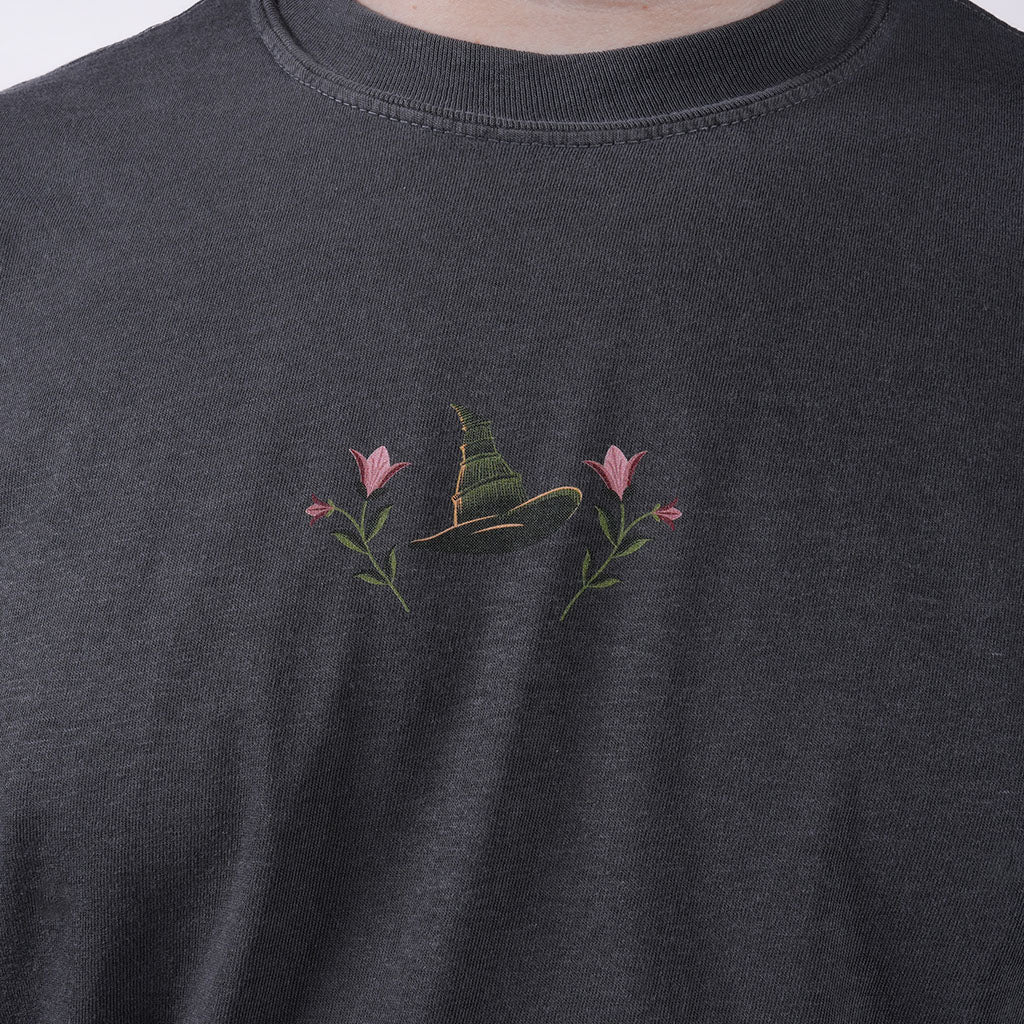 close-up of design on the front of the WICKED: FOR GOOD T-Shirt in Charcoal