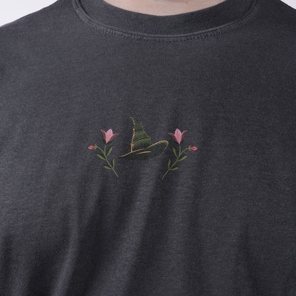 close-up of design on the front of the WICKED: FOR GOOD T-Shirt in Charcoal