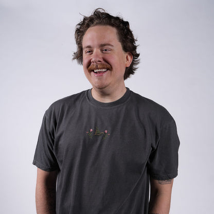 man wearing WICKED: FOR GOOD T-Shirt in Charcoal